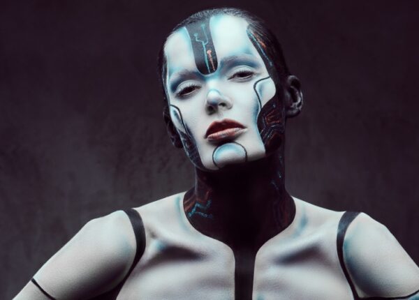 Sensual cyber woman. Technology and future concept. Isolated on a dark textured background.